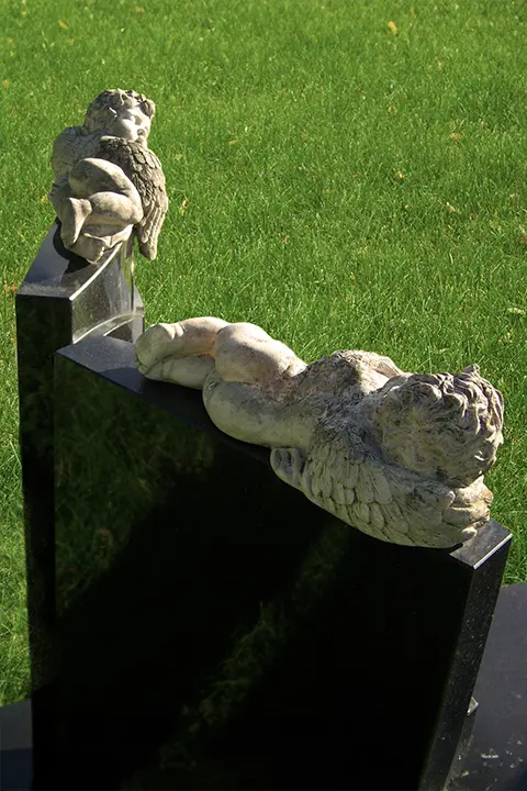 Two cherubs on tombstone