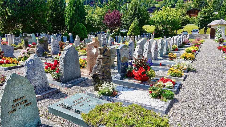Headstones in gravel cemetery