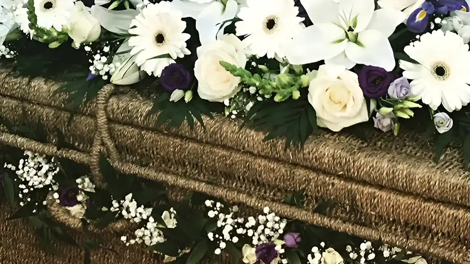 Flowers on wicker coffin