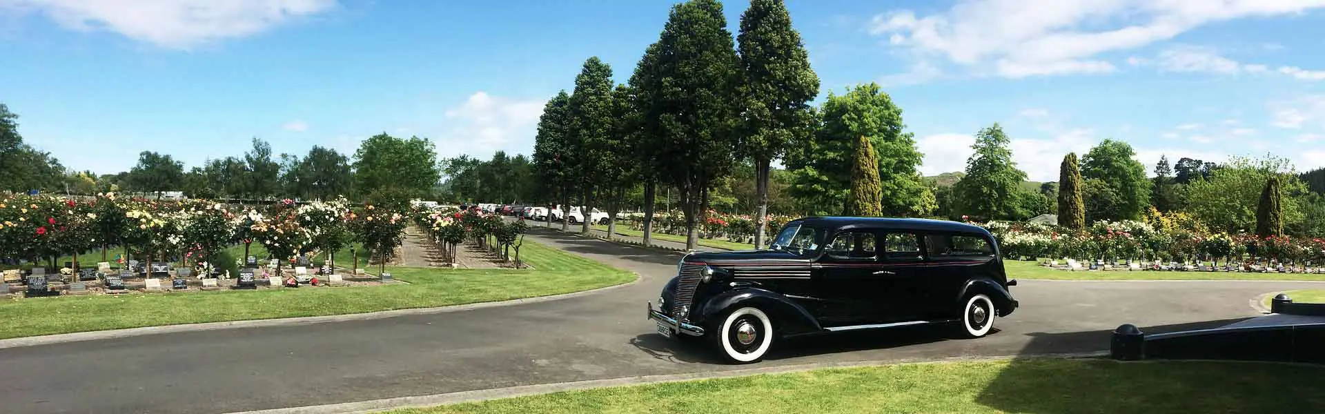 Funeral hearse in cemetery