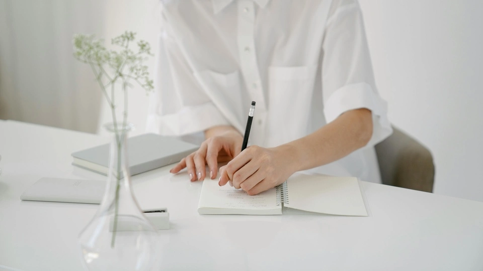 Woman writing in notebook
